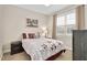 Bright bedroom with a comfortable bed and window views at 1704 Little Drake Ave, Willow Springs, NC 27592