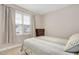 Bedroom with a bed and window overlooking the neighborhood at 1704 Little Drake Ave, Willow Springs, NC 27592