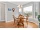 Kitchen breakfast nook with window seat and wood table at 1704 Little Drake Ave, Willow Springs, NC 27592
