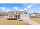One-story house with attached garage, landscaping, and large yard at 1704 Little Drake Ave, Willow Springs, NC 27592