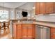 Kitchen with stainless steel appliances, double sink, and breakfast bar at 1704 Little Drake Ave, Willow Springs, NC 27592