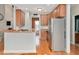 Open kitchen with island and stainless steel appliances at 1704 Little Drake Ave, Willow Springs, NC 27592