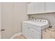 Laundry room with washer, dryer, and cabinets at 1704 Little Drake Ave, Willow Springs, NC 27592