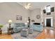 Bright and airy living room with hardwood floors and access to the foyer at 1704 Little Drake Ave, Willow Springs, NC 27592