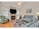 Spacious living room featuring a stone fireplace and comfortable seating at 1704 Little Drake Ave, Willow Springs, NC 27592