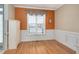 Home office with orange accent wall, wood floors, and wainscoting at 1704 Little Drake Ave, Willow Springs, NC 27592