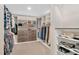 Well-organized walk-in closet with custom shelving at 1704 Little Drake Ave, Willow Springs, NC 27592