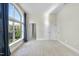 Bright bedroom with neutral carpeting, large window with city view and ample closet space at 200 S Dawson St # 406, Raleigh, NC 27601