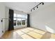 Bright living room with hardwood floors and large windows at 200 S Dawson St # 406, Raleigh, NC 27601