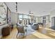 Spacious living room with hardwood floors, large windows, and ample natural light at 200 S Dawson St # 406, Raleigh, NC 27601