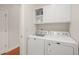 Laundry room with washer, dryer, and cabinets at 204 Serenity Hill Cir, Chapel Hill, NC 27516