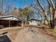 Gravel driveway, carport and detached building in backyard at 2517 Academy St, Sanford, NC 27332