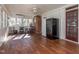 Bright sunroom with wood flooring, a ceiling fan, and access to the outdoors at 2517 Academy St, Sanford, NC 27332