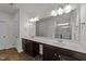 Well-lit bathroom with double sink vanity, ample counter space and large mirror at 256 Barbour Farm Ln, Four Oaks, NC 27524