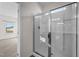 Bright bathroom showcasing the tiled walk-in shower with glass door at 256 Barbour Farm Ln, Four Oaks, NC 27524