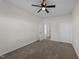 A carpeted bedroom with neutral walls and a ceiling fan at 256 Barbour Farm Ln, Four Oaks, NC 27524