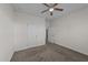 A carpeted bedroom with neutral walls and a ceiling fan at 256 Barbour Farm Ln, Four Oaks, NC 27524