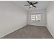 A carpeted bedroom with neutral walls and a ceiling fan at 256 Barbour Farm Ln, Four Oaks, NC 27524