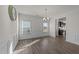 Bright dining room with wood floors, neutral walls, and a stylish chandelier at 256 Barbour Farm Ln, Four Oaks, NC 27524