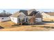 Well-maintained home with neutral siding, a manicured lawn and an attached garage at 256 Barbour Farm Ln, Four Oaks, NC 27524