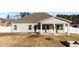 Rear view of home showcasing covered patio at 256 Barbour Farm Ln, Four Oaks, NC 27524