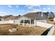 Aerial rear view of home showing covered patio and fenced backyard at 256 Barbour Farm Ln, Four Oaks, NC 27524