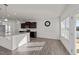 Bright kitchen with white countertops, stainless steel appliances, and hardwood floors at 256 Barbour Farm Ln, Four Oaks, NC 27524