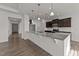 Bright kitchen with white countertops, stainless steel appliances, and hardwood floors at 256 Barbour Farm Ln, Four Oaks, NC 27524