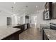 Modern kitchen with stainless steel appliances, granite countertops, and hardwood floors at 256 Barbour Farm Ln, Four Oaks, NC 27524
