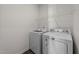 Bright laundry room featuring modern appliances at 256 Barbour Farm Ln, Four Oaks, NC 27524
