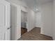 Convenient hallway laundry room with modern appliances and ample storage space at 256 Barbour Farm Ln, Four Oaks, NC 27524