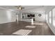 Bright living area featuring an open floor plan and kitchen access at 256 Barbour Farm Ln, Four Oaks, NC 27524