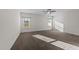Spacious main bedroom featuring a ceiling fan and two windows providing natural light at 256 Barbour Farm Ln, Four Oaks, NC 27524
