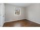 Bright bedroom with hardwood floors and a window at 307 Colony Woods Dr, Chapel Hill, NC 27517