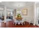 Open concept dining area with hardwood floors and wood table at 309 Dechlan Ln, Cary, NC 27513