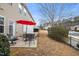 Small patio with seating area and red umbrella at 309 Dechlan Ln, Cary, NC 27513