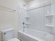 Clean bathroom with tub, shower, and shelving at 310 Church St # 35, Wendell, NC 27591