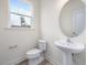Powder room with pedestal sink and hardwood floors at 310 Church St # 35, Wendell, NC 27591