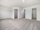 Carpeted bedroom with en-suite bathroom and walk-in closet at 310 Church St # 35, Wendell, NC 27591