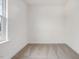Small bedroom with carpeted floor and window at 310 Church St # 35, Wendell, NC 27591