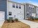 Townhouse exterior featuring attached garage and landscaping at 310 Church St # 35, Wendell, NC 27591