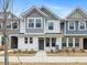 Two-story townhome with gray and white siding, and a gray front door at 310 Church St # 35, Wendell, NC 27591