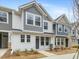 Two-story townhome with gray and white siding, and a gray front door at 310 Church St # 35, Wendell, NC 27591