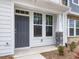 Front entrance with gray door and stone accents at 310 Church St # 35, Wendell, NC 27591