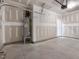 Unfinished garage with water heater and door at 310 Church St # 35, Wendell, NC 27591