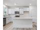 Modern kitchen with stainless steel appliances and white cabinets at 310 Church St # 35, Wendell, NC 27591