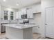 Modern kitchen with white cabinets and quartz countertops at 310 Church St # 35, Wendell, NC 27591