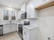 White kitchen with stainless steel appliances and white cabinets at 310 Church St # 35, Wendell, NC 27591