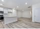 Open concept kitchen with gray island and hardwood floors at 310 Church St # 35, Wendell, NC 27591