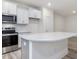 Kitchen island with white cabinets and quartz countertops at 310 Church St # 35, Wendell, NC 27591